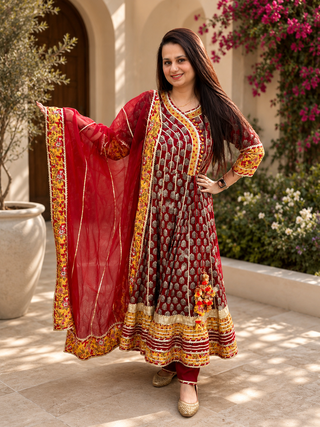 Maroon Anarkali kurta set with red dupatta, gold border detailing and ethnic festive design for women by Adishee.