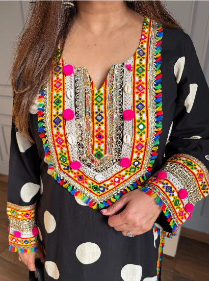 Palki black cotton rayon Chogha set with white polka dots, multicolour embroidery and pom-pom detailing.