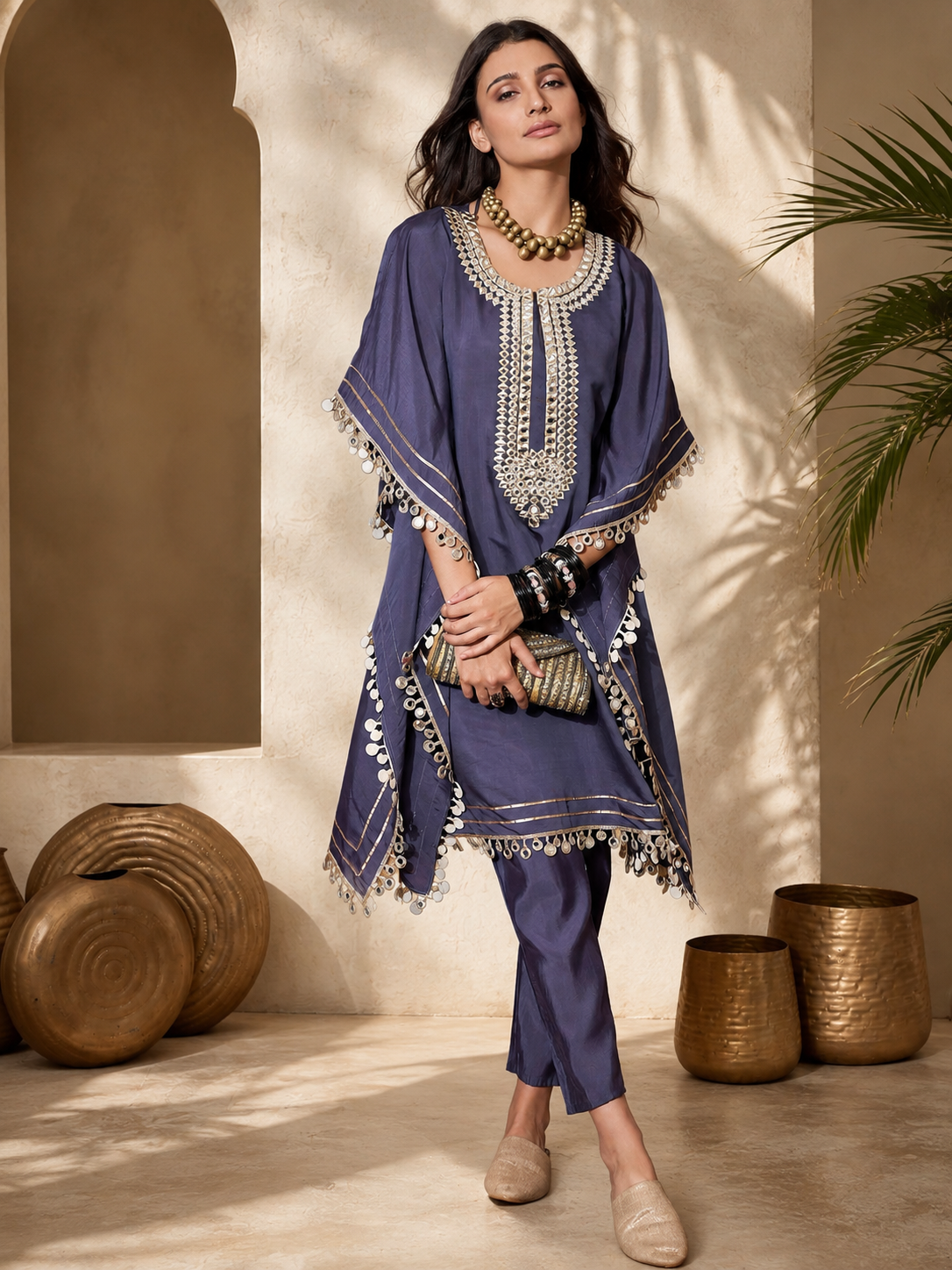 Women's navy blue embroidered kaftan co-ord set featuring intricate silver embroidery, flowing kaftan sleeves, and matching straight-fit pants, perfect for festive and party wear.