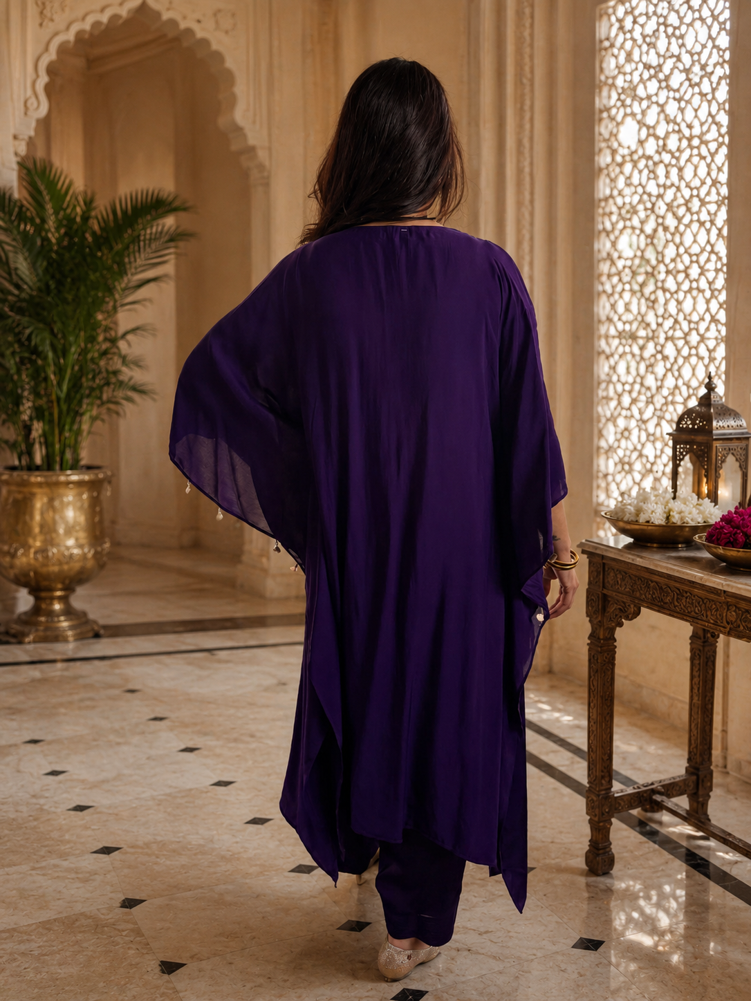 Women's purple embroidered kaftan suit set featuring intricate silver embroidery, flowing kaftan-style kurta, matching pants, and elegant draped sleeves, perfect for festive and evening wear by Adishee Australia.