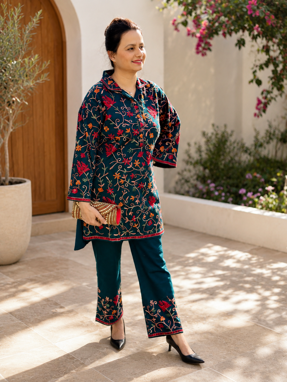 Teal floral co-ord kurta set with matching pants and colourful embroidered-style detailing for women by Adishee.