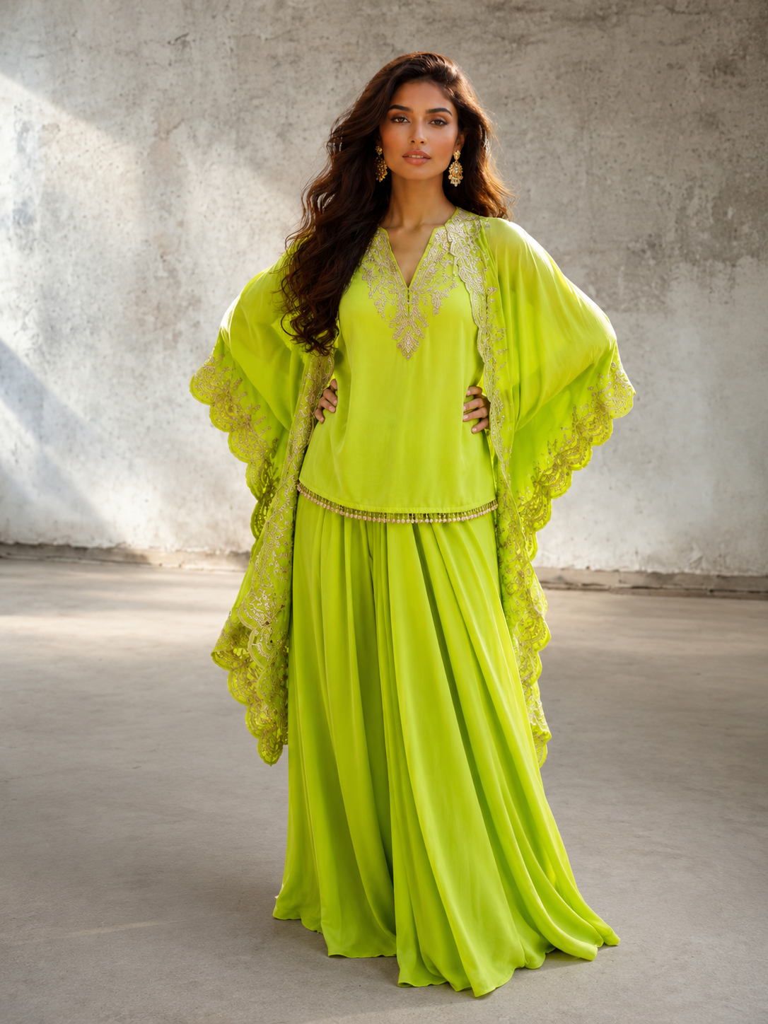 Lime green Indo Western dress with stitched skirt, embroidered top, and matching cape by Adishee.