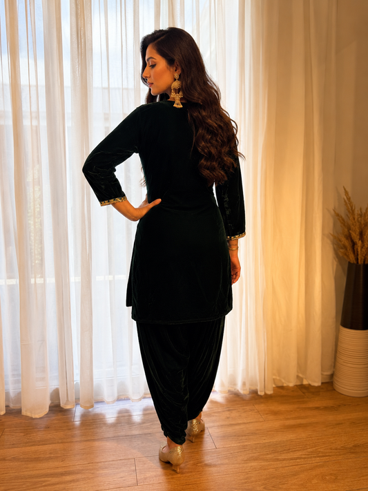 Back view of bottle green velvet embroidered kurta set with matching bottoms from Adishee