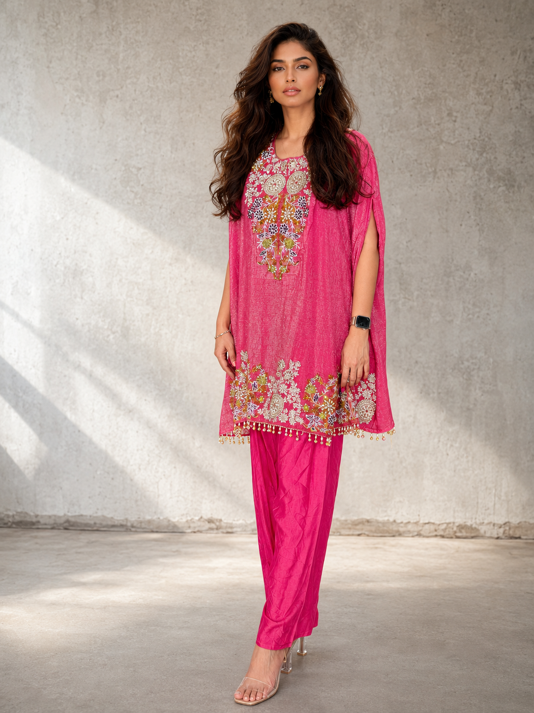 Pink embroidered cape-style kurta set with matching pants and colourful floral detailing for women by Adishee.