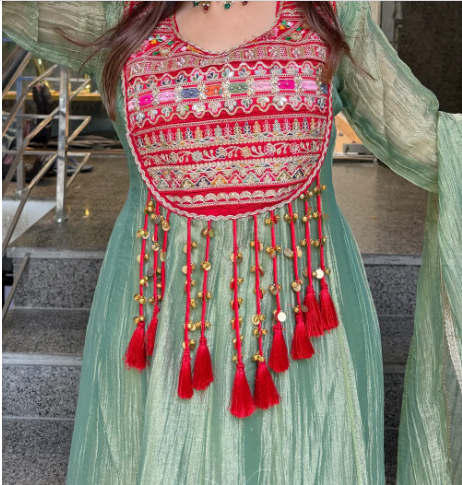Sage green Crush Shimmer Tissue Anarkali with red and gold embroidery, tassel detailing and matching dupatta.